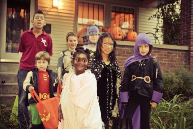 Young children trick or treating