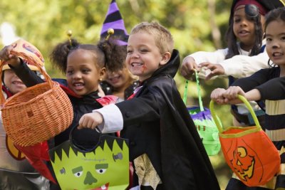 Young children in their Halloween costumes