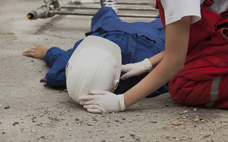 Emergency first aid being carried out at workplace